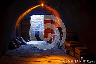 Military cellar upstairs Image from an military cellar with Stacks of old military ammunition boxes and upstairs with Stock Photo