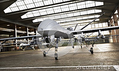 Military Drone UAV aircraft`s with ordinance in position in a hangar awaiting a strike mission. Stock Photo