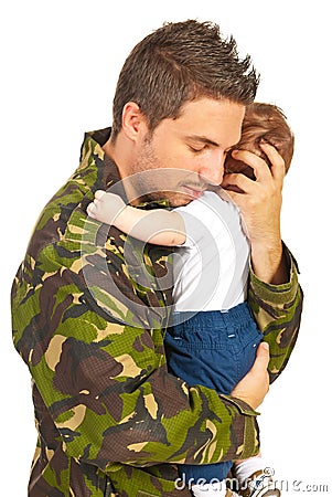 Military father embracing his baby son Stock Photo