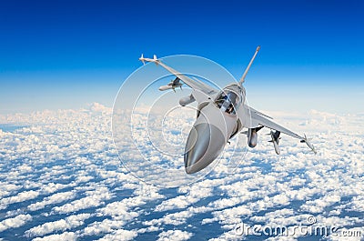 Military fighter jet above the clouds. Stock Photo