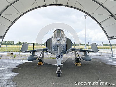 Military fighter jet in a hangar outside Editorial Stock Photo