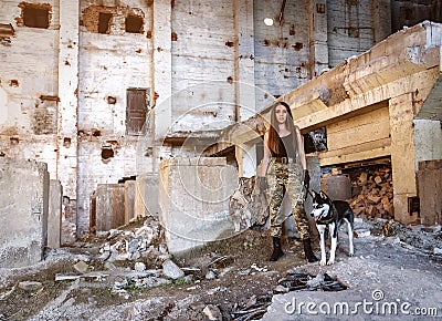 Military girl with husky dog Stock Photo