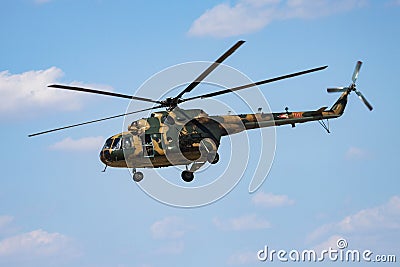 Military helicopter at air base. Air force flight operation. Aviation and aircraft. Air defense. Military industry. Fly and flying Editorial Stock Photo