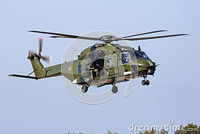 Military helicopter at air base. Air force flight operation. Aviation and aircraft. Air defense. Military industry. Fly and flying Editorial Stock Photo