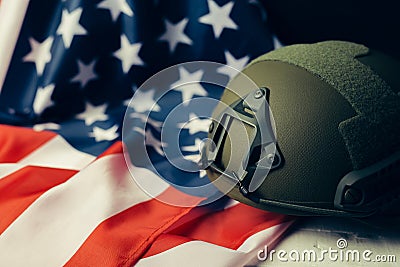 Military helmets and American flag on background Stock Photo