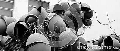 Military helmets are assembled in the likeness of a tree b and w Stock Photo