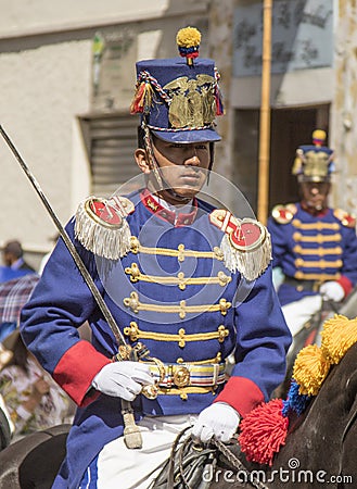 Military honor guard in historic uniforms march in parade on horseback Editorial Stock Photo