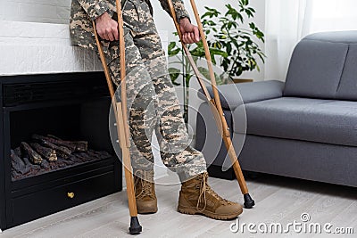 military man with crutches, disability Stock Photo