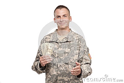 Serviceman with money extends his hand Stock Photo