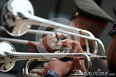 Military musicians performing trumpets and trombones, optional focus outdoor marching band. Editorial Stock Photo