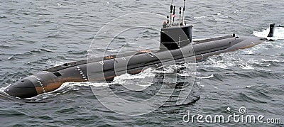 Military nuclear submarine launching torpedo missile in expansive oceanic waters Stock Photo