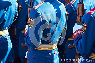 Military parade in a city, soldiers in full dress uniforms ordered in parade formation, russian text on the Chevron - armed forces Editorial Stock Photo