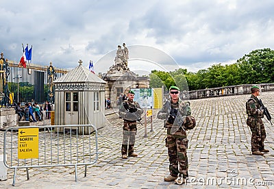 Military patrol, keeping the order, near Main entrance of Versailes Editorial Stock Photo