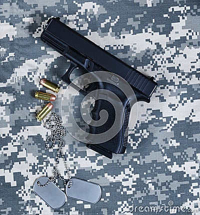 A military pistol and ID tags for the holidays of Memorial, 4th of July and Labor Day Stock Photo