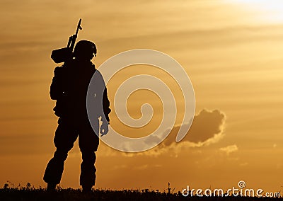 Military soldier silhouette with machine gun Stock Photo