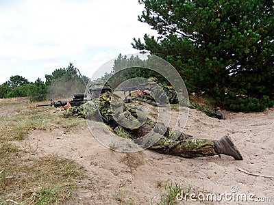 Military, soldier and target with weapon and aim for fitness, battle or challenge outdoor with gear or hiding. Army Stock Photo