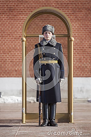 Military student stands in sentry box in guard in honor of grave of the Unknown Soldier and The Eternal Flame in Moscow. Editorial Stock Photo