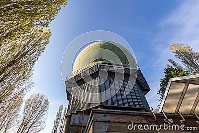 Military tracking system, radar base. Old giant dome of a radar antenna of a Belgium military base. Editorial Stock Photo