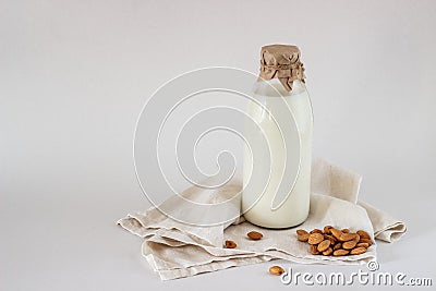 Milk and almonds on a white background Stock Photo