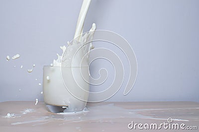 Milk being poured into a glass Stock Photo