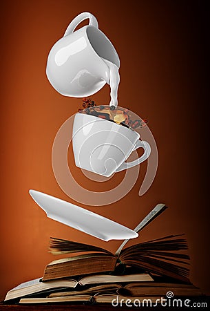 Milk being poured into small cup of coffee. 3d Stock Photo