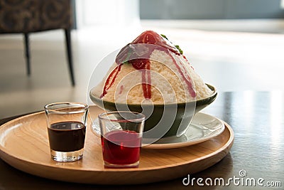 Milk Bingsu shaved ice strawberry syrup topping Stock Photo