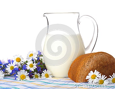Milk, bread and field flowers Stock Photo