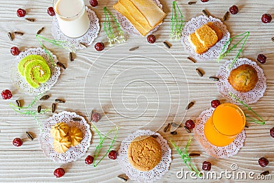 Milk Butter Bread Garlic Bread Banana Cupcake Orange Juice Cupcake Cookie Cake Roll Sunflower Seed and Gooseberry on White Wooden Stock Photo