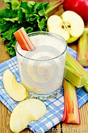 Milk cocktail with rhubarb and apples on the board Stock Photo
