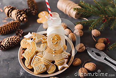 Milk and cookies. Gingerbread cookies on a gray background. Christmas cookies. Stock Photo