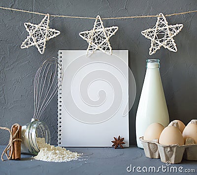 Milk, eggs, flour, cinnamon on the table. Notepad with place for recipe text. ingredients for making breakfast Stock Photo