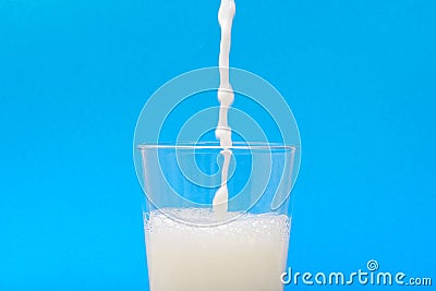 Milk when inflowing into the jar Stock Photo