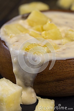 milk pineapple yogurt with pieces of pineapple and other fruits Stock Photo