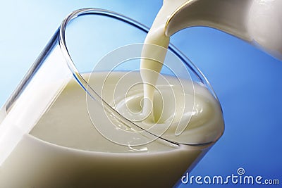 Milk pour in glass Stock Photo