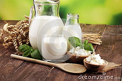 Milk products. tasty healthy dairy products on a table. sour cream in a white bowl, cottage cheese bowl, cream in a a bank and Stock Photo