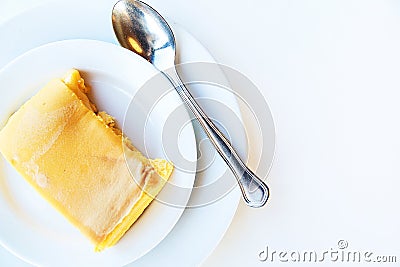 Milk pudding on white plate. Top view Stock Photo