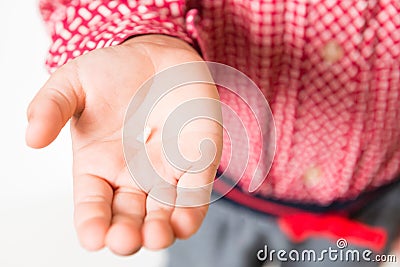 Milk-tooth in hand of kid Stock Photo