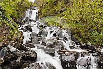 Milky waterfall near lake Ritsa Stock Photo