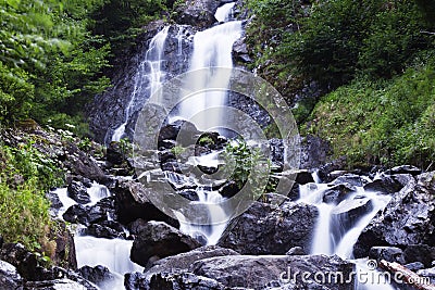 Milky waterfall near Ritsa lake Stock Photo