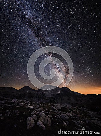 Milky Way galaxy and mountain peaks. Stock Photo