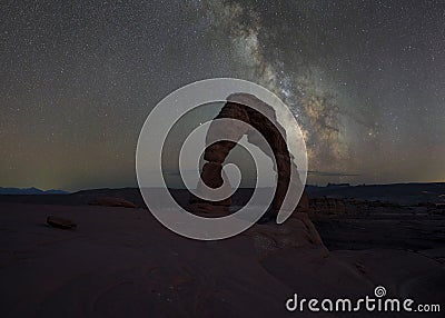 Milky Way galaxy rising behind Delicate Arch in Moab Utah Stock Photo