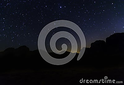 Milky Way and a lot of stars over the mountain at Wadi Rum desert Stock Photo