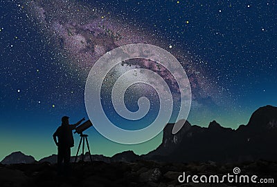 Milky way and the man with telescope Stock Photo