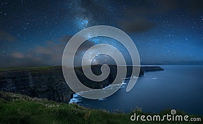 Milky way over Cliffs of Moher Stock Photo