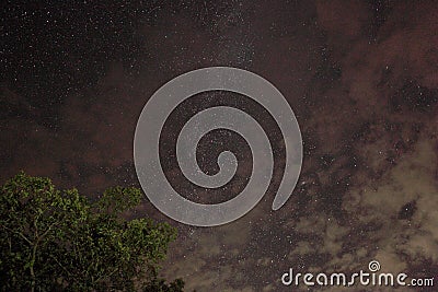 Milky way over the clouds Stock Photo