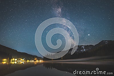 Milky way over lake Spitzingsee in the bavarian alps Stock Photo