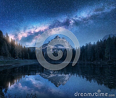 Milky Way over mountains and Antorno lake at night Stock Photo