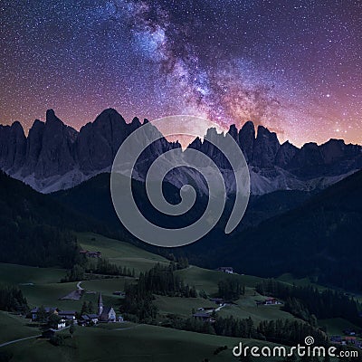 Milky Way over Santa Maddalena in Dolomites, Italy Stock Photo