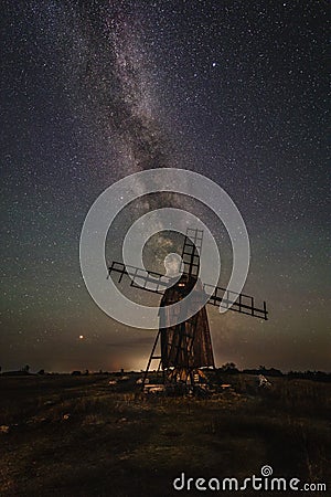 Milky Way over a windmill att Gettlinge burrial ground Stock Photo