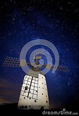 Milky way over windmill Stock Photo